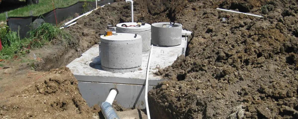 Septic system repair and installation site with tank access ports in Fort Wayne, IN